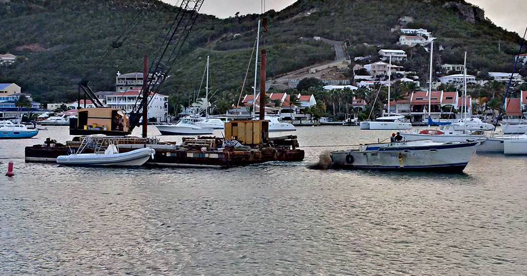 The fireworks barge being pulled into place for tonight's display in Simpsons Bay Lagoon. Happy New Year shaping up!!