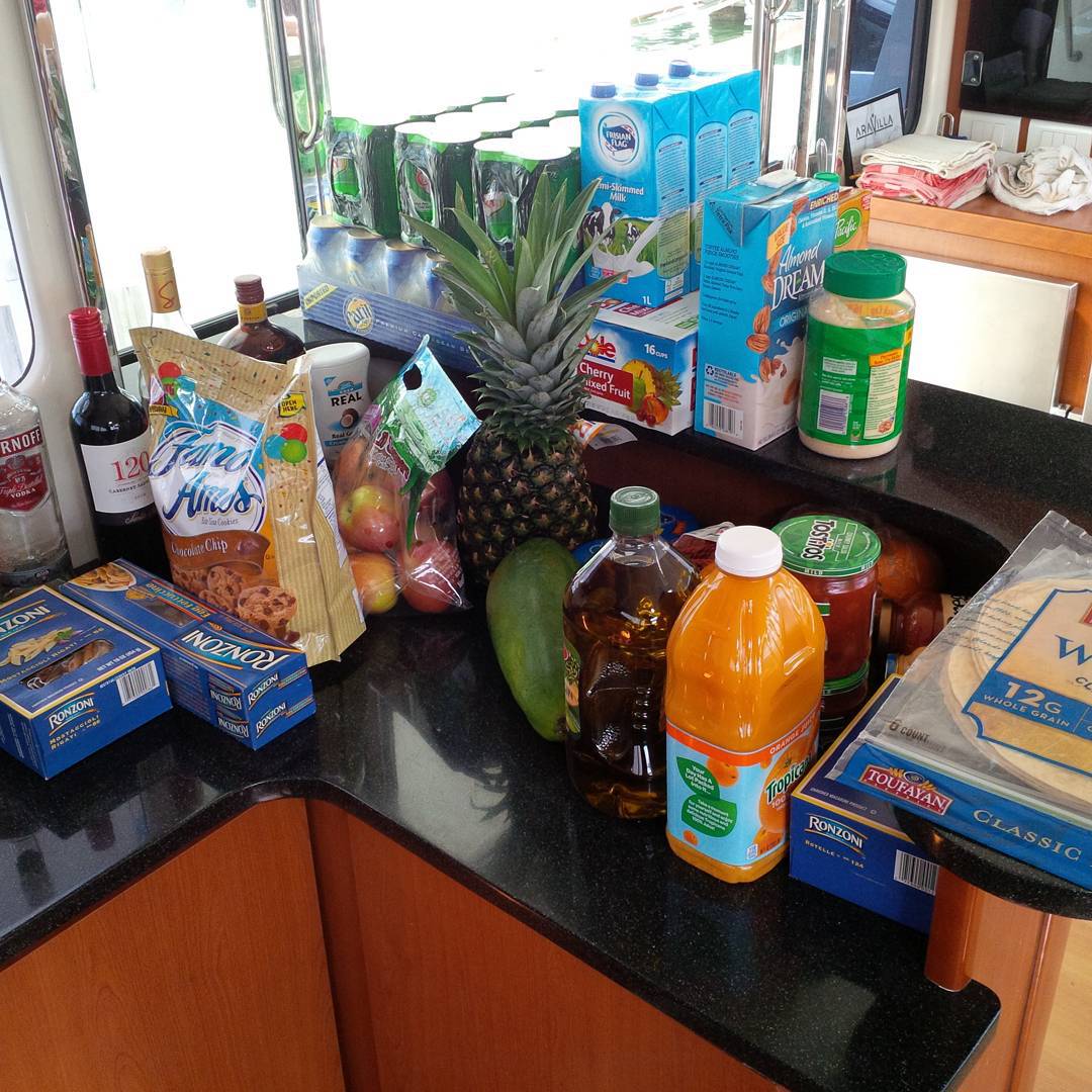 Provisioning for charter has begun. How do you feed 9 people for one week without going ashore? Lots of food and drink!!